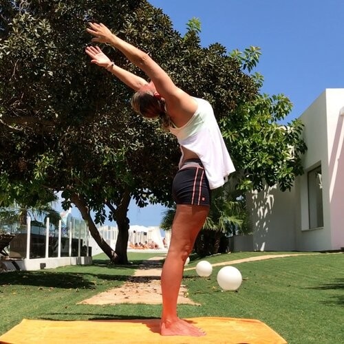 Lee-ann stretching up in the garden